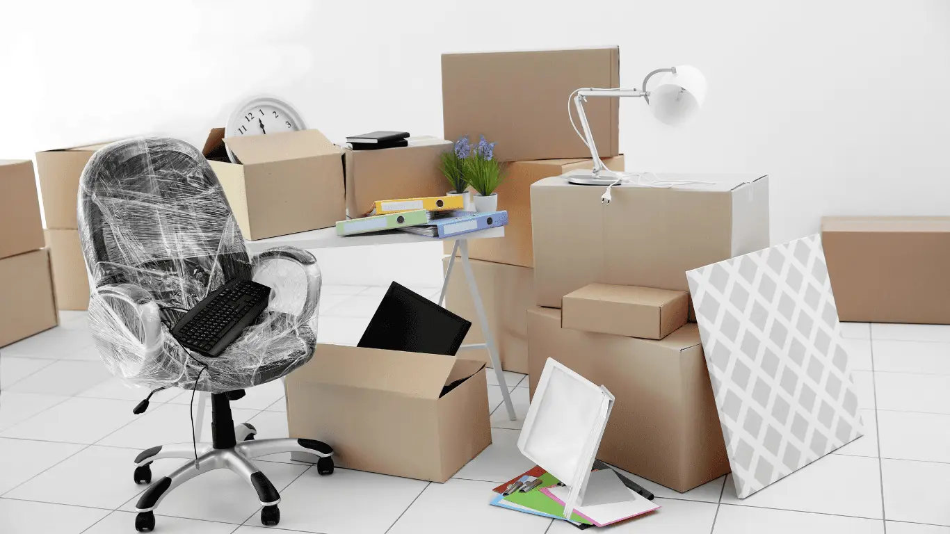 Experienced Packers & Movers packing office furniture for smooth relocation